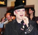 Boy George enjoying a lollipop before the signing... Photo