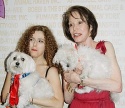 The two hosts pose with some new furry friends... Photo