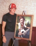 Hugh stands proudly with his Broadway Wall of Fame painting Photo