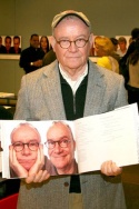 Buck Henry displaying his photos in a book Photo