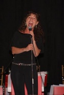 Jodie Langel belting one out to the audience Photo