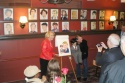 Liz Smith presents Jay Johnson and Bob with their caricature Photo