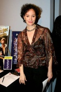 Barbara Walsh with the Company items for silent auction Photo