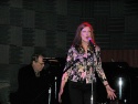 The beautiful and also very talented, Annette O'Toole
sings while husband, Michael p Photo