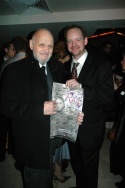Jamie McGonnigal presenting Charles Strouse with a signed poster from the show Photo