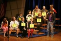 Derrick Baskin with (from bottom row) cast and spellers, including Jessica-Snow Wilso Photo