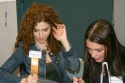 Bernadette Peters and Angie Martinez tabulating scores to determine a winner Photo