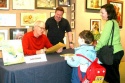 John Lithgow reads a poem written by young fan Jason Applebaum while Peter Glassman a Photo