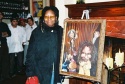 Whoopi posing with the painting  Photo