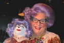 Dame Edna poses with her bear...

 Photo