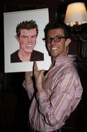Gavin Lee signs his caricature Photo