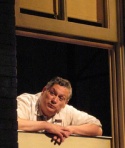 Here is Harvey Fierstein leaning out "the apartment window" during a rehearsal of the Photo