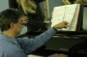 Music Director Rob Fisher prepares to play Photo