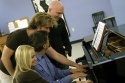 (From bottom to top) Kristin Chenoweth, Music Director Rob Fisher, Malcolm Gets, and  Photo