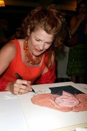 Signing her painting for the wall...  Photo