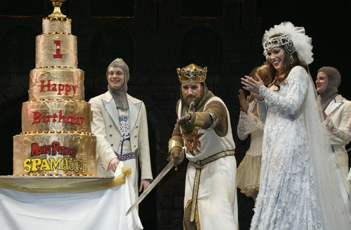 Peter Davison and Hannah Waddingham present the birthday cake at the curtain call Photo