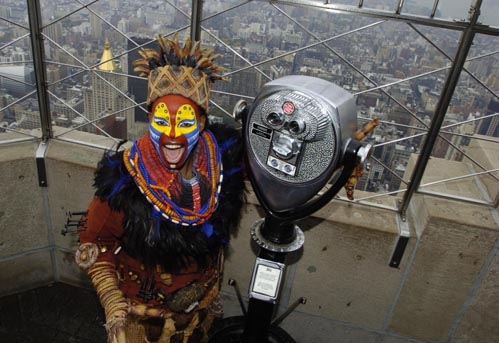 Tshidi Manye (Rafiki) atop the Empire State Building Photo