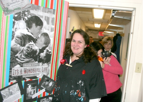 Terri Purcell of the Wardrobe Department and their It's A Wonderful Life-themed door Photo