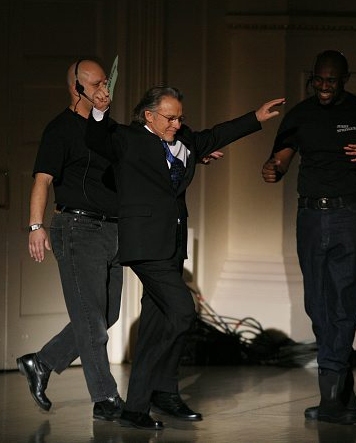 Harvey Keitel escorted on-stage by security Photo