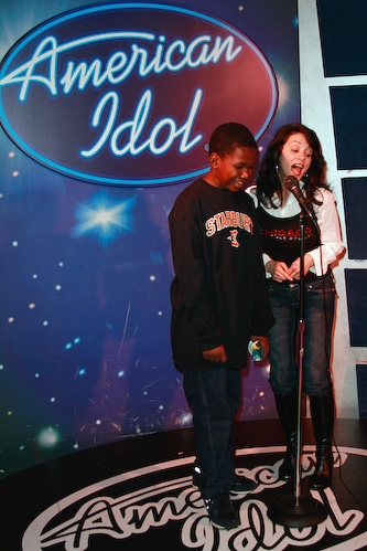 Chicago's Donna Marie Asbury sings karaoke with a guest Photo