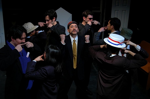 45.  Paul Juhn (center) and others in Moustache Guys. Photo