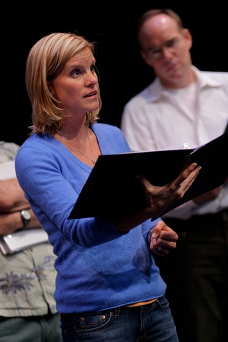 Jenn Colella with Michael Winther in the background Photo