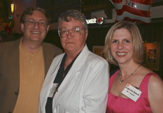 Hugh and Deborah Gelch of Newton flank retiring Executive Director Pat Gleeson
 Photo