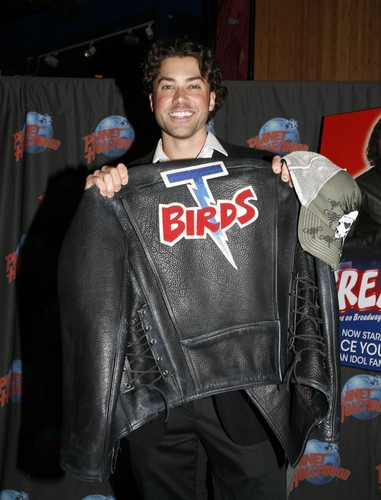 Ace Young displays his T-Birds jacket Photo