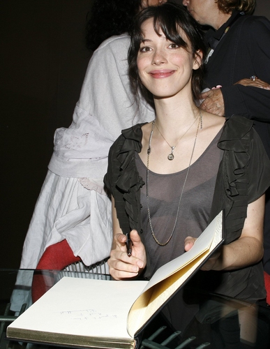 Rebecca Hall signing the Official book

 Photo