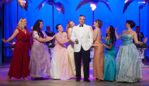 Robert Pavlovich (Lawrence Jameson) and the female ensemble of DIRTY ROTTEN SCOUNDREL Photo