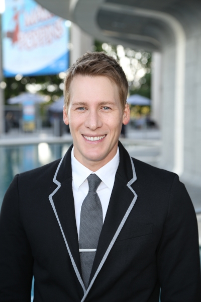 Writer Dustin Lance Black poses during the arrivals for the opening night performance Photo
