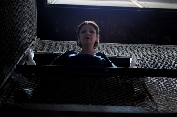  Paulette Oliva, portraying Ms. Lionetti, stares down the fabled chute in Barbicide,  Photo