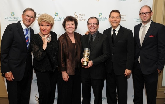  VH1 President Tom Calderone, displays his 2012 Music Has Power AwardÃ‚Â® from t Photo