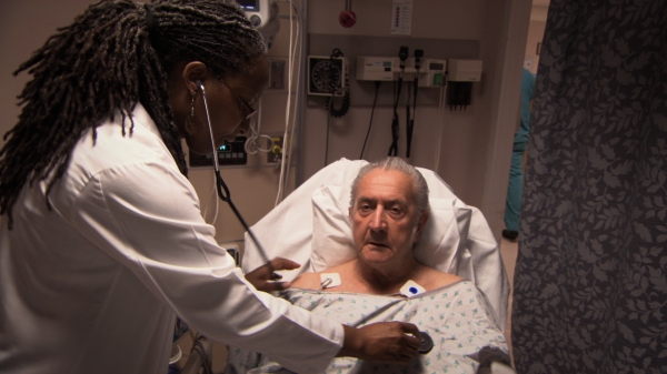  Emergency Room Physician, Dr Pamela Ross examines patient in ER at University of Vir Photo