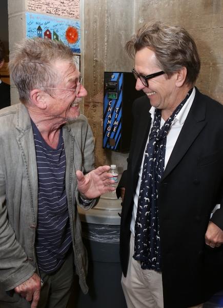 From left, cast member John Hurt is greeted by actor Gary Oldman backstage after the  Photo