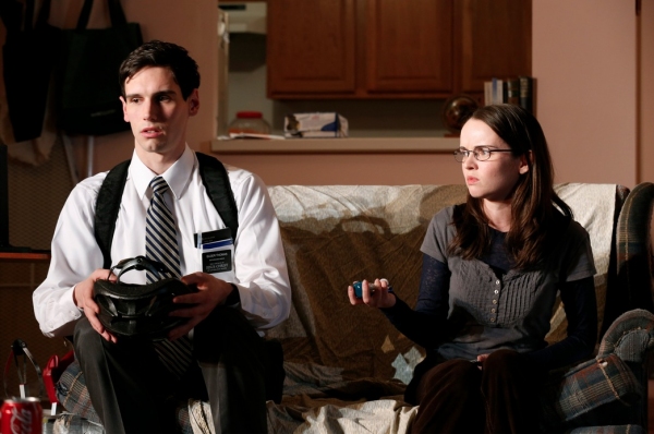 Cory Michael Smith as Elder Thomas and Reyna de Courcy as Ellie Photo