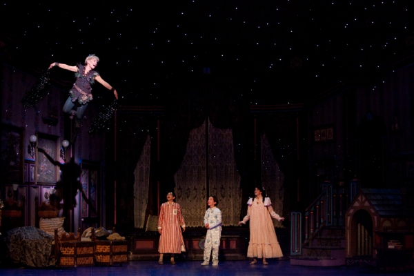 Cathy Rigby as Peter Pan shows the Darling children how to fly. Photo