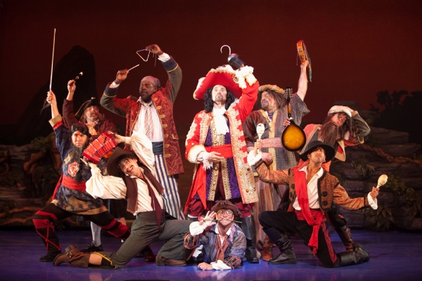 Brent Barrett as Captain Hook with his band of pirates. Photo