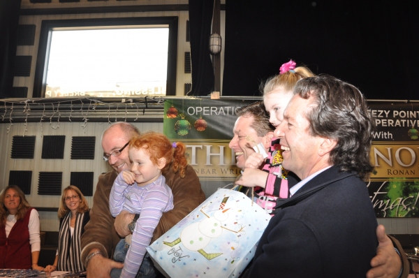 Ronan Tynan, Anthony Kearns and Finbar Wright with the younger storm survivors Photo