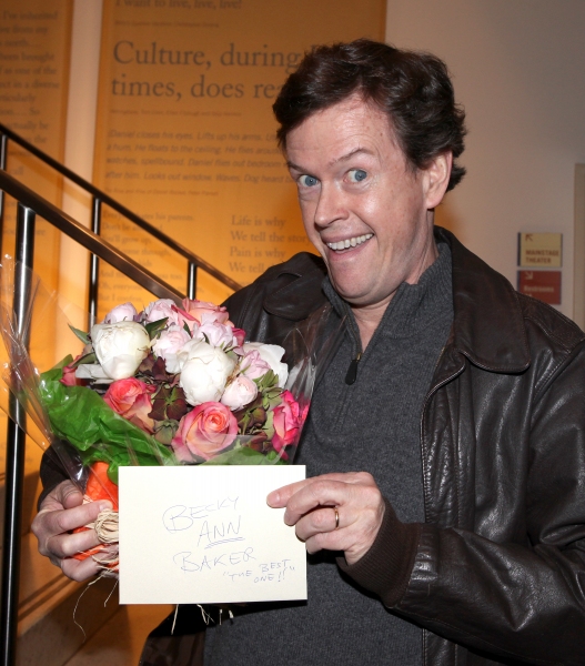 Dylan Baker with flowers for his wife Photo