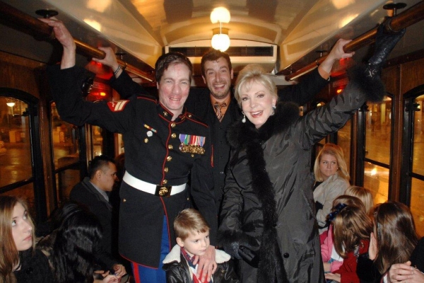 On the trolley USMC Cpl Aaron Mankin, Travis Coursey, Patricia Kennedy Photo