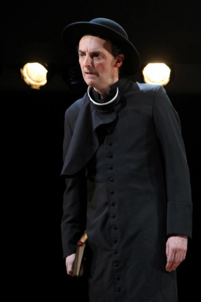 John Keating (who also plays Verges) doubles here as the Friar. Photo by Henry Grossm Photo