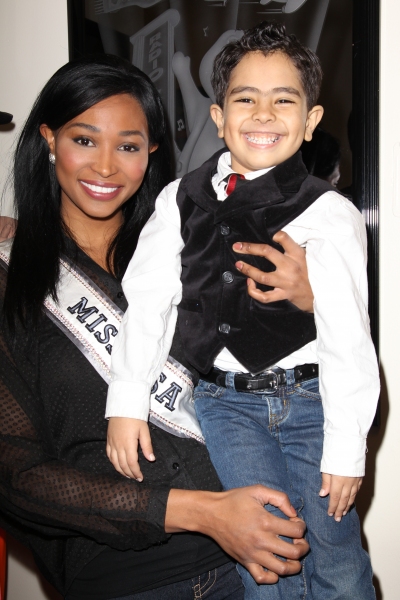 Miss USA Nana Meriwether poses with five-year-old Malik Naser of Make a Wish Foundati Photo