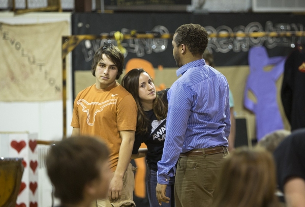 Students and Phillip Taylor, director at Rogers High School, at an intense rehearsal. Photo