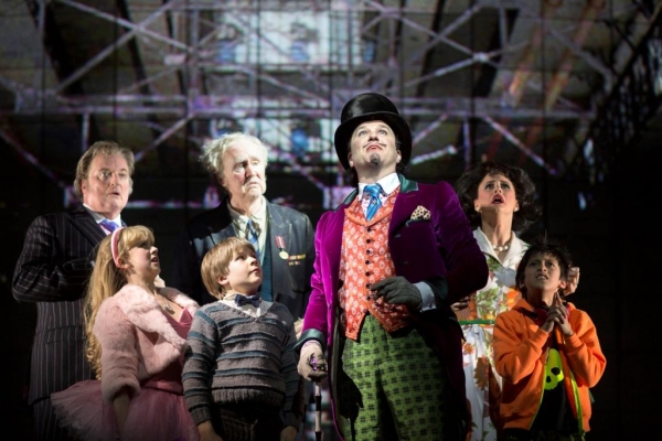 Douglas Hodge as Willy Wonka with Jack Costello as Charlie and cast members Photo