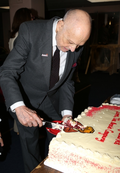 Charles Strouse cuts into the ''Annie'' Logo requested by his grandaughter Photo