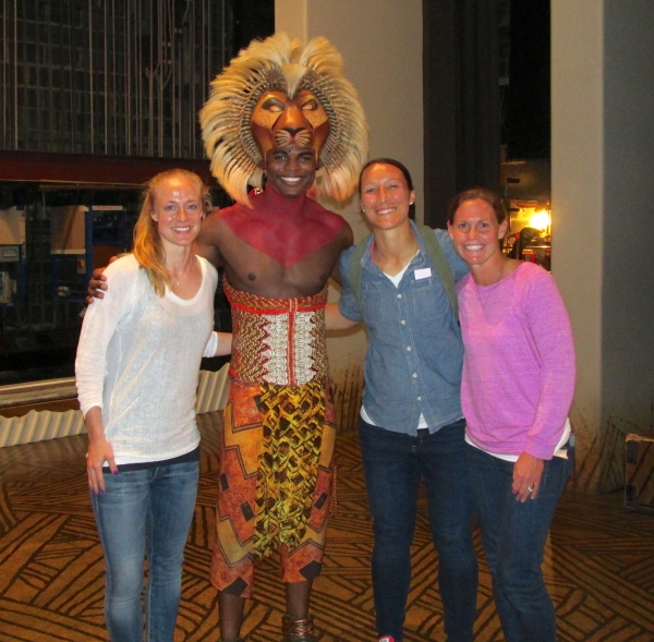 Andile Gumbi (Simba) with Becky Sauerbrunn, Jill Loyden and Christie Rampone Photo