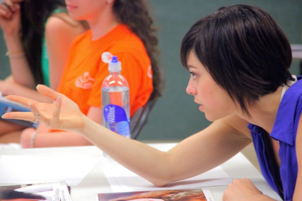 Krysta Rodriguez works with a student
 Photo