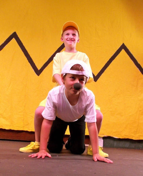 Collin George as Woodstock and Miles Synder as Snoopy Photo