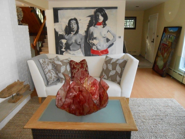 Painting by Kevin Berlin dominates living room Photo